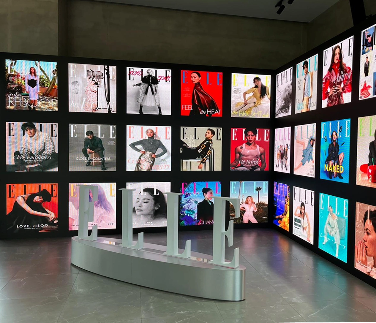 Fashion exhibition installation featuring a high-resolution modular LED video wall gallery and 3D ELLE logo staging display