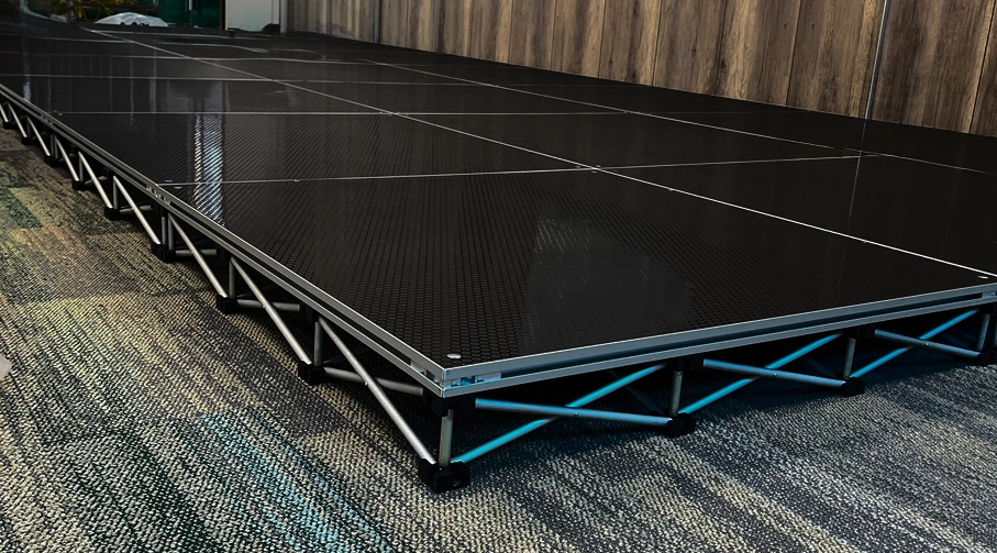 Professional modular raised event stage platform and trussing setup